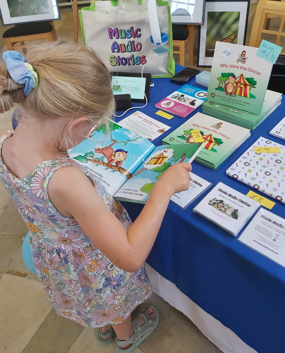 A child reading the Billy Joins the Circus picture book at Brompton Annual Open Day image