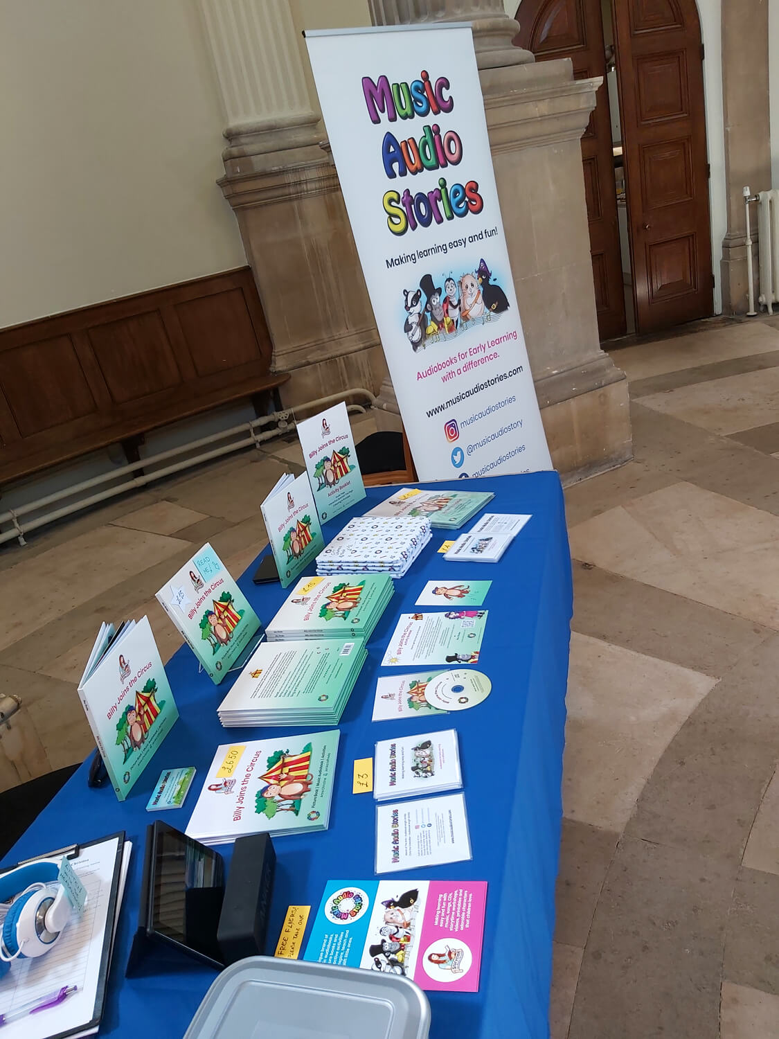 Author, Anna Christina with her picture book, Billy Joins the Circus at the Music Audio Stories stall at Brompton Annual Open Day image