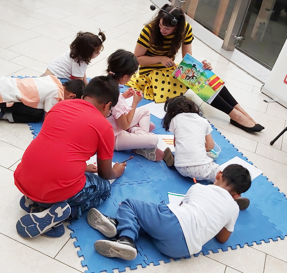 Anna Christina drawing with the children at The O2 image