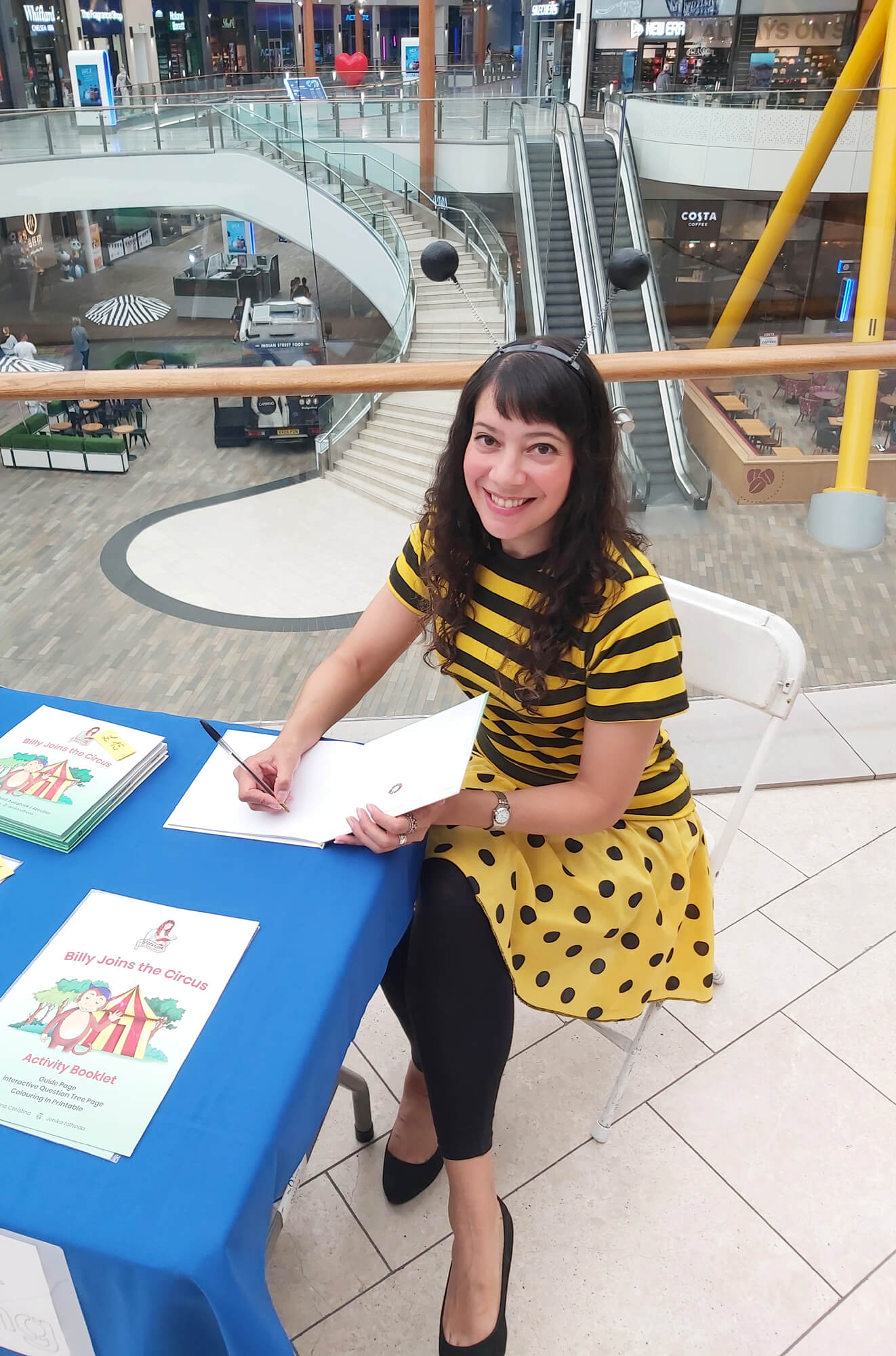 Author Anna Christina signing Billy Joins the Circus picture books image